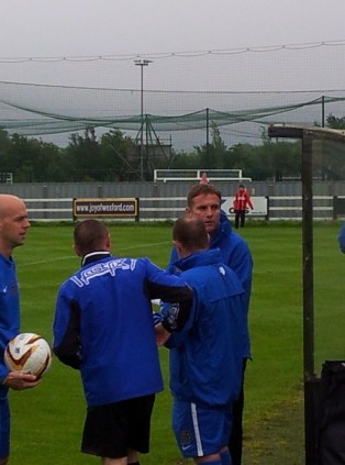 Phil Parkinson talks to his coaching staff